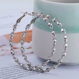 Silver twist design hoop earrings